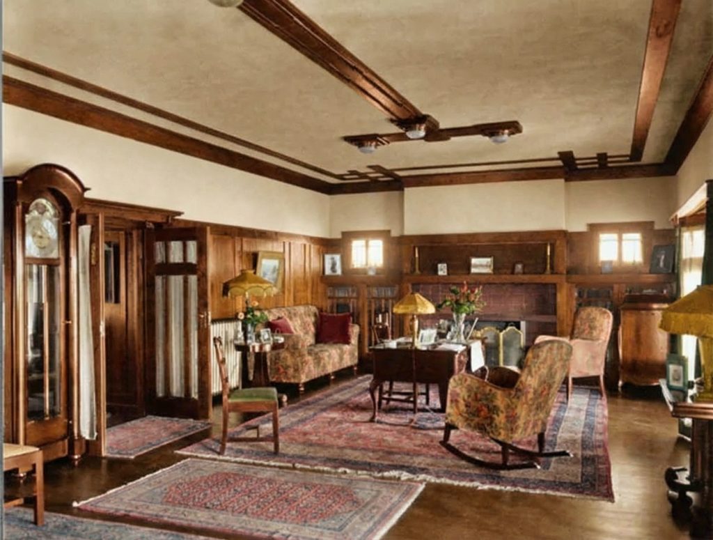 An alternate 1915 view of the living room in The Dr. S. S. Crow House by Leroy Hulbert, highlighting the room's spaciousness and wood-beamed ceiling.