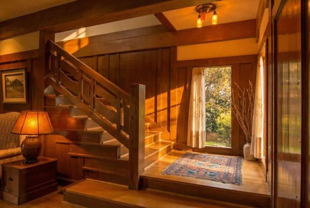 Wooden stairway inside The Earle C. Anthony house displaying handcrafted joinery and Arts and Crafts design elements