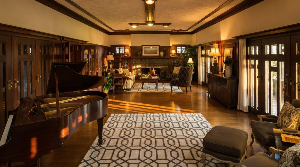 A view from the dining room looking into the living room of The Dr. S. S. Crow House, emphasizing the home's open and gracious floor plan.