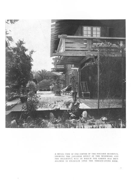 Page from the August 1912 Craftsman article on Greene and Greene showing a single black-and-white photograph of a corner of the Pitcairn residence, with a wood balcony, exposed beam ends, a stone-paved terrace, garden plantings allowed to grow up to the building, and a second-story bedroom porch visible above.