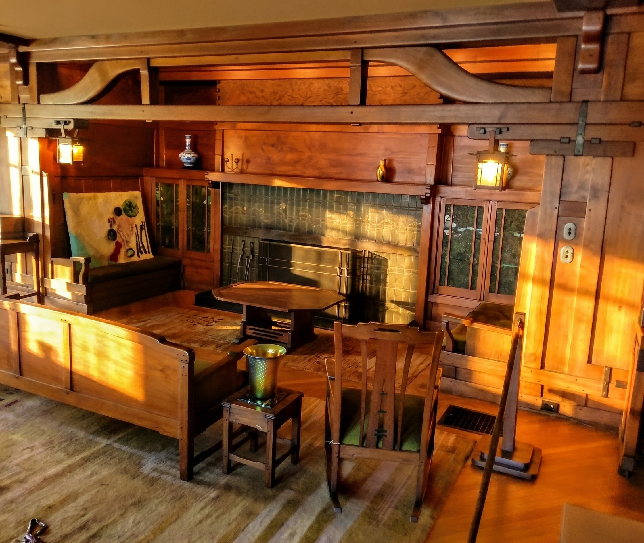 Inglenook beams in the Gamble House living room showing cloud-lift profiles with softened, rounded edges